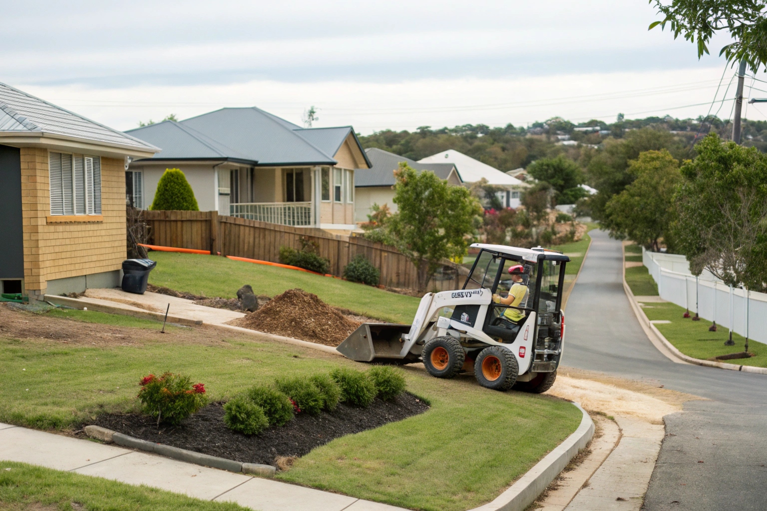 Skid steer loader completing fine trim site preparation on residential block Fraser Coast