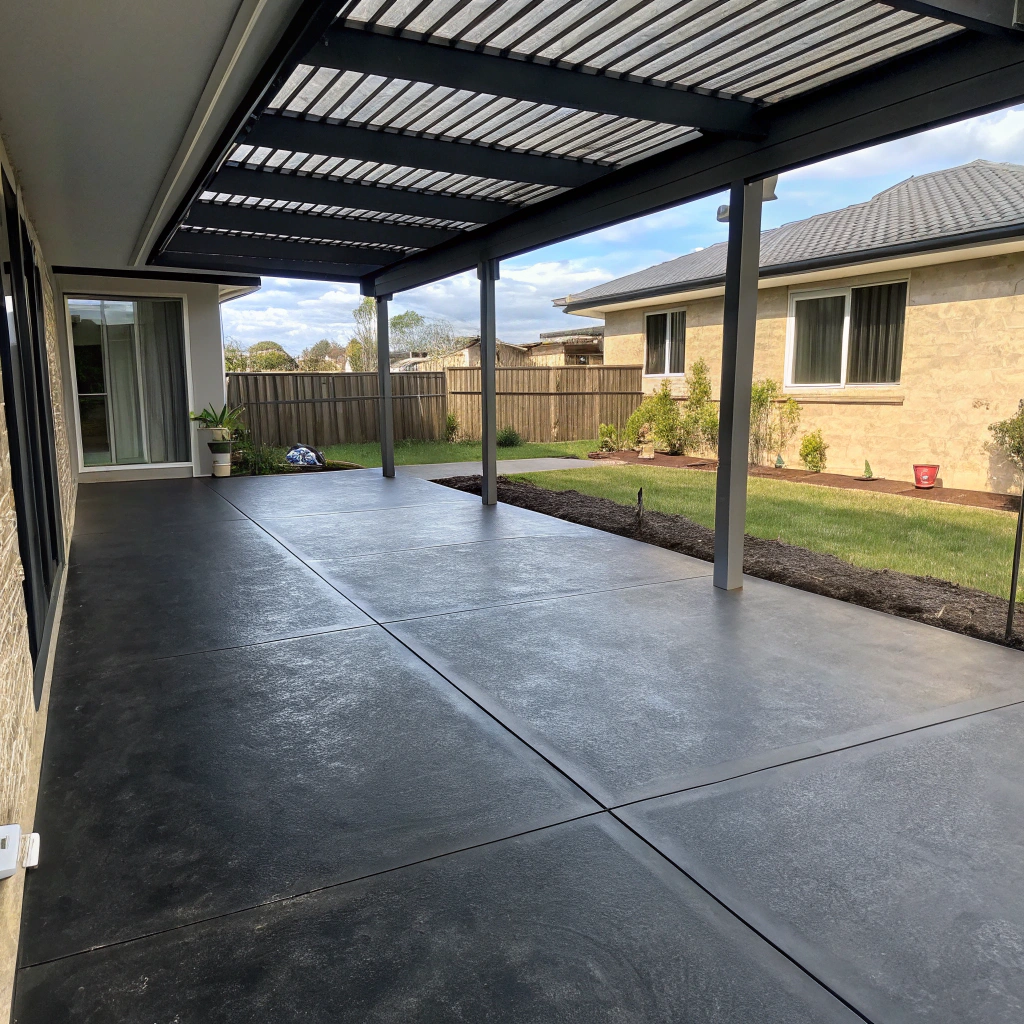Coloured concrete patio slab in a Hervey Bay backyard